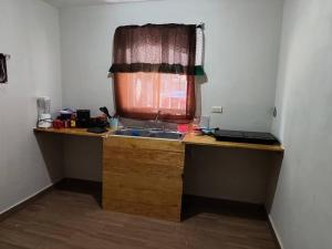 a kitchen with a sink and a window at Casa Villa (facturamos) in Los Mochis