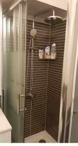 a shower in a bathroom with a shower curtain at Gibraltar Gem in Gibraltar