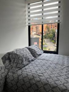A bed or beds in a room at Apartamento moderno tipo loft