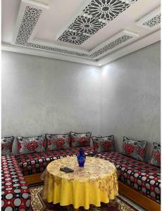a living room with a couch and a table at Sabar house in Tangier