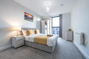 a bedroom with a large bed and a tv at Birmingham City Center - Luxury Stay 119 in Birmingham