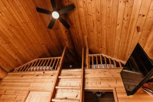 an overhead view of two bunk beds in a wooden cabin at Riverside Resort in Whistler