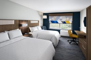 Postel nebo postele na pokoji v ubytování Holiday Inn Express & Suites Lima by IHG