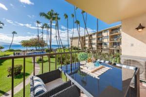 a balcony with a view of the ocean at Kanai A Nalu 211 in Wailuku