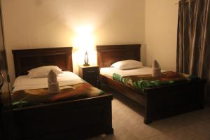 Кровать или кровати в номере Hotel Green Prundi