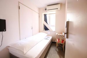 Letto o letti in una camera di Sakura Hotel Jimbocho
