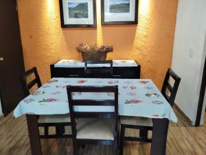 a table with two chairs and a table with a table cloth at QUINTA SAN LUCAS TLAXCALA 