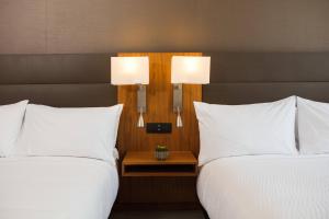 Cama ou camas em um quarto em AC Hotel by Marriott Panama City