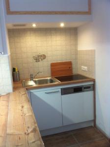 a kitchen with a sink and a counter top at Ferienwohnung im Haus Landskron in Landskron