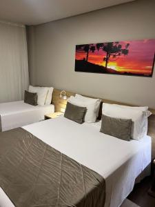 Tempat tidur dalam kamar di Apto 175 - Gramado Golden Laghetto Resort