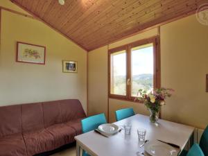 a living room with a couch and a table at Chalet authentique avec terrasse, animaux acceptés - FR-1-496-242 in Saint-Rirand +13 photos