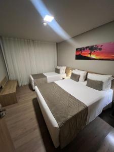 Tempat tidur dalam kamar di Apto 175 - Gramado Golden Laghetto Resort