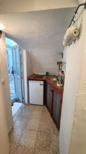 a kitchen with a sink and a counter top at Casa James in Vejer de la Frontera