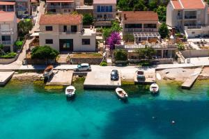 an aerial view of a marina with boats in the water at Apartment Zrnovska Banja 3154a in Korčula