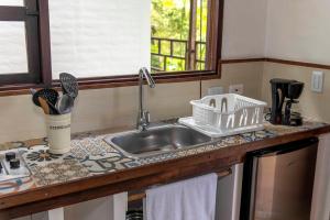 a kitchen with a sink and a counter top at La Maima in Dapa
