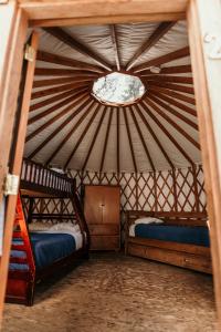 a room with two bunk beds in a yurt at Riverside Resort in Whistler