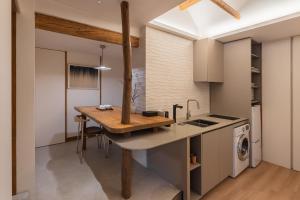 a kitchen with a wooden counter top in a room at Luxury hanok with private bathtub - Happyjae in Seoul