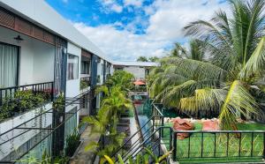 a balcony view of a resort with a swimming pool at Central Corner Suite in Siem Reap