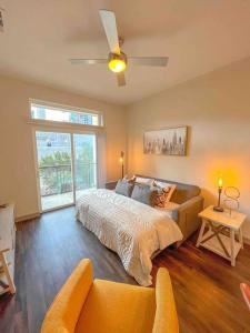 a bedroom with a bed and a couch and a window at Downtown Houston Gem: Parking Pool WiFi Sleeps 4 in Houston