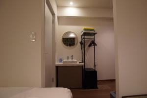 Postel nebo postele na pokoji v ubytování MARUKOU HOTEL