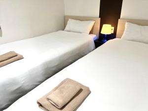 Postel nebo postele na pokoji v ubytování Hotel Links Dobutsuenmae