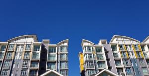 a tall apartment building with a blue sky in the background at G Residence - 2R2B Barrington Night Market (2) in Brinchang