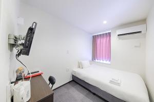 Voodi või voodid majutusasutuse HOTEL THE POINT Kyoto Station South toas