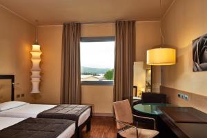 Llit o llits en una habitació de Hotel Cruise