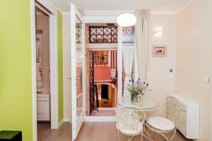a dining room with a glass table and chairs at Suites One in Zadar