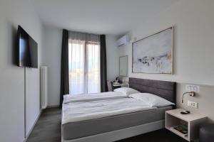 Postelja oz. postelje v sobi nastanitve Hotel Luna Garni