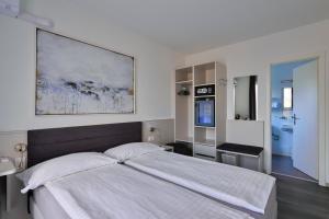 Postelja oz. postelje v sobi nastanitve Hotel Luna Garni
