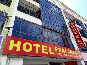 a hotel sign on the side of a building at OYO 90842 Hotel Prai Jaya in Perai