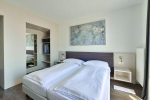 Postelja oz. postelje v sobi nastanitve Hotel Luna Garni