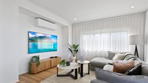 Dreamviews at Metung的电视和/或娱乐中心