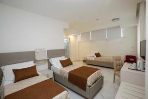 Posteľ alebo postele v izbe v ubytovaní Vomero High Hotel