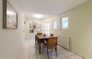 a dining room with a table and chairs at Villa Incanto in Ascona