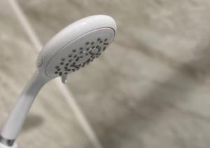 a close up of a white toothbrush at 3 Bedroom Apartment, Ballymena, The Wee Stop Gap in Ballymena +17 photos