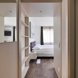Postelja oz. postelje v sobi nastanitve Hotel Luna Garni