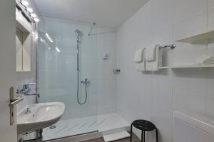Kopalnica v nastanitvi Hotel Luna Garni