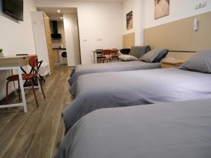 Alianza Suites客房内的一张或多张床位