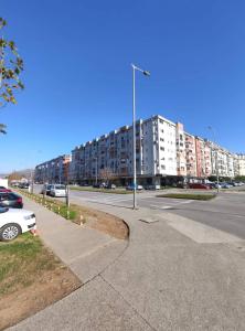 a city street with a street light and buildings at CITY POINT Apartment in Podgorica
