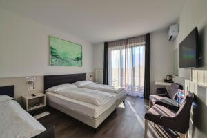 TV in/ali zabaviščno središče v nastanitvi Hotel Luna Garni