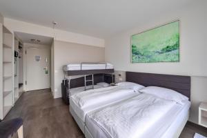 Postelja oz. postelje v sobi nastanitve Hotel Luna Garni