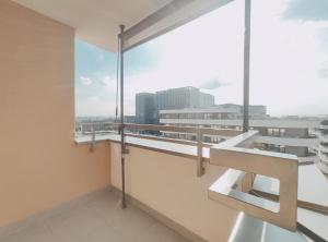 a balcony with a view of a city skyline at Dobrego Pasterza 120D by Homeprime in Kraków