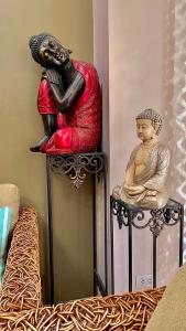 a statue of a woman sitting on top of a couch at Pico De Loro 2BR Carola B Unit with Lagoon View in Nasugbu