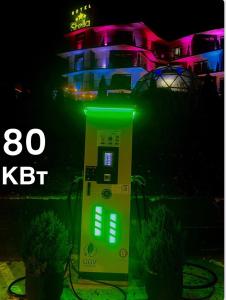 a machine with green lights in front of a building at Stella in Ternopil