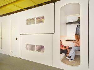 a group of people sitting in a white trailer at CityHub Rotterdam in Rotterdam