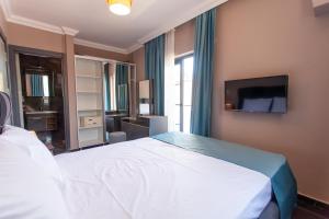 Postel nebo postele na pokoji v ubytování Turkuaz Villa + 11 fotografií