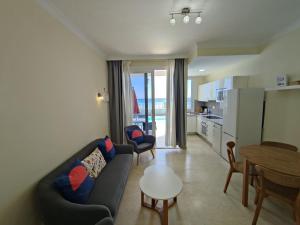 a living room with a couch and a table at Los Nidos in San Bartolomé