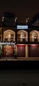 a building with two garage doors in the night at Bhagyashree Guest House in Varanasi